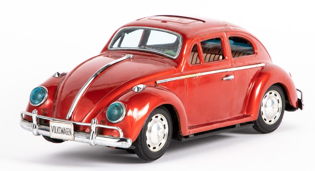 Japanese Bandai tin lithograph battery operated VW: Japanese Bandai tin lithograph battery operated Volkswagen, with visible engine, 15'' l. Provenance: Estate of Jonathan Barrow, Los Angeles, California.