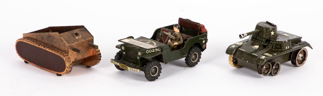 Arnold lithograph wind-up US military Jeep, etc.: Arnold tin lithograph wind-up US military police Jeep, with driver, 6 1/2'' l., together with a Gama tin lithograph tank, 5'' l. and a hand hammered copper tank ashtray. Provenance: Estate of Jonathan