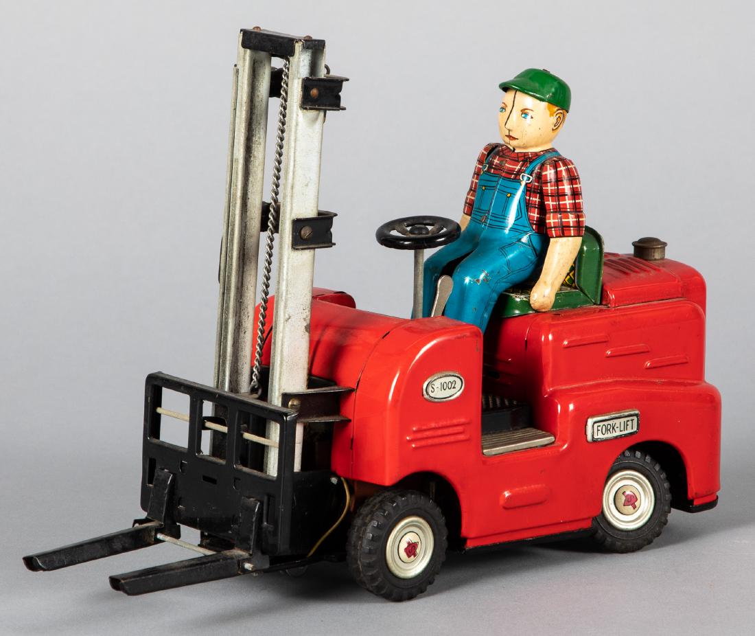 Japanese tin lithograph battery operated fork-lift: Japanese tin lithograph battery operated fork-lift , with driver, 8'' h. Provenance: Estate of Jonathan Barrow, Los Angeles, California.