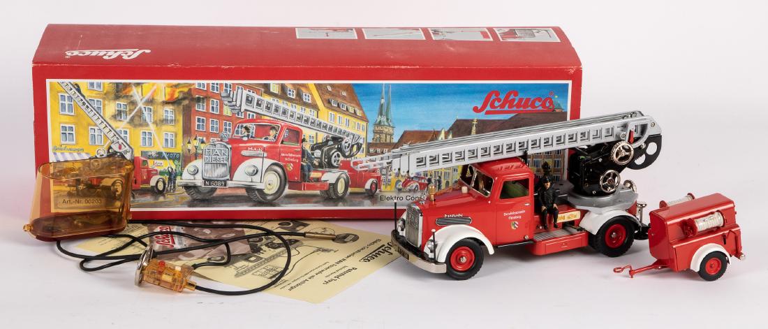 Schuco contemporary fire ladder truck: Schuco contemporary MAN Elektro Construction fire ladder truck, in the original box with accessories, 2007, truck is 13 1/2'' l. Provenance: Estate of Jonathan Barrow, Los Angeles, California.