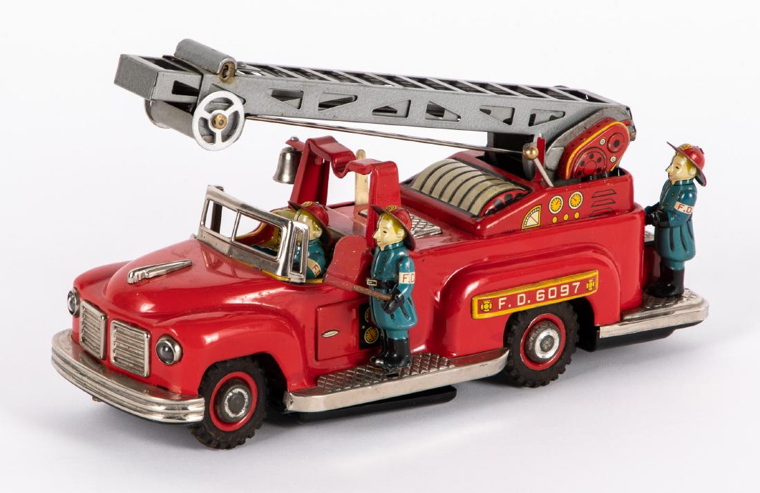 Japanese TN tin lithograph fire ladder truck: Japanese TN tin lithograph battery operated fire ladder truck, 10 1/2'' l. Provenance: Estate of Jonathan Barrow, Los Angeles, California.