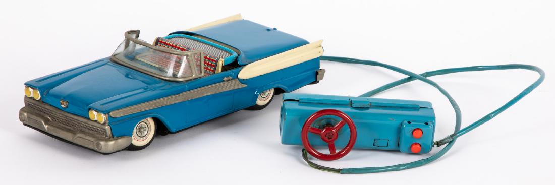 Japanese tin Ford Fairlane Skyliner convertible: Japanese tin battery operated Ford Fairlane Skyliner convertible, with retractable roof and remote control, 11'' l. Provenance: Estate of Jonathan Barrow, Los Angeles, California.