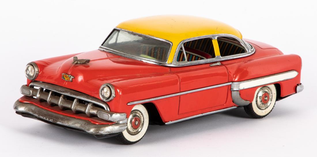 Japanese Marusan tin Chevrolet Belair: Japanese Marusan tin battery operated Chevrolet Belair, with headlights, 11 1/4'' l. Provenance: Estate of Jonathan Barrow, Los Angeles, California.