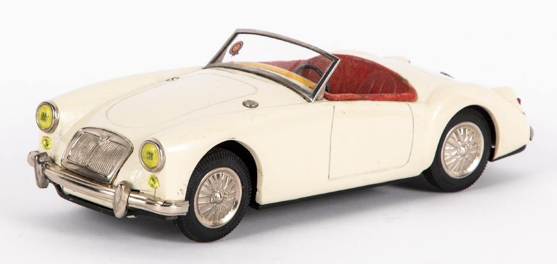 Japanese ATC tin friction MG convertible: Japanese ATC tin friction MG convertible, 9 1/2'' l. Provenance: Estate of Jonathan Barrow, Los Angeles, California.