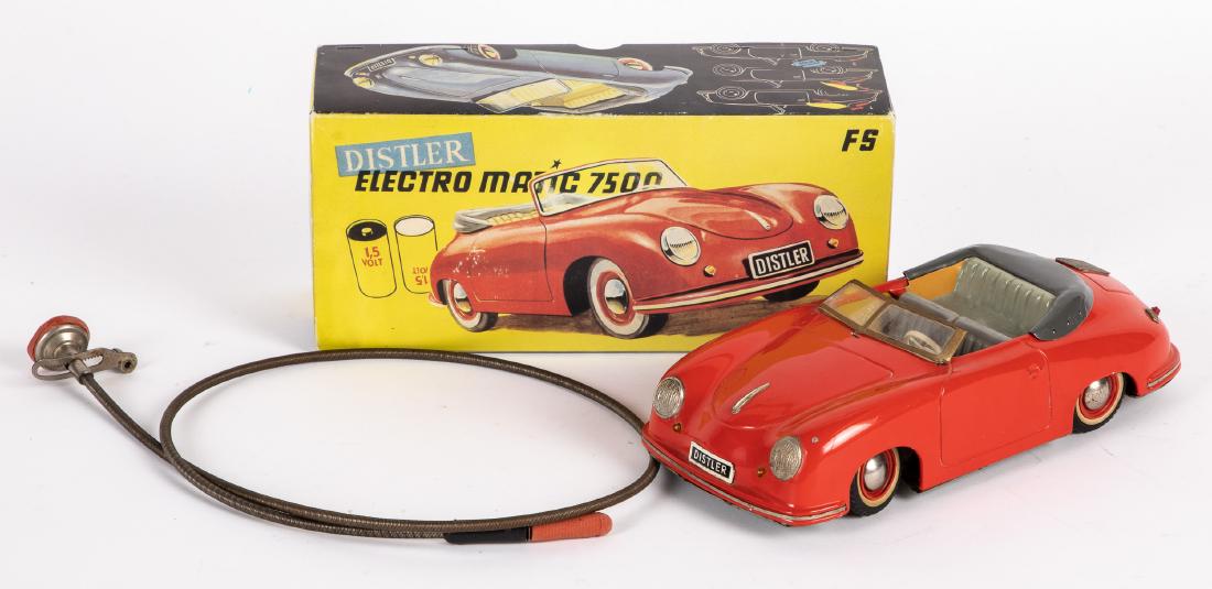 Distler tin battery operated Porsche convertible: Distler tin battery operated Electromatic 7500 Porsche convertible, with the original box, 10'' l. Provenance: Estate of Jonathan Barrow, Los Angeles, California.