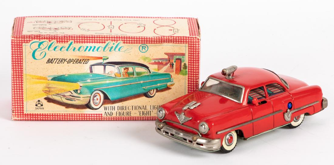 Japanese Marusan battery operated Electromobile: Japanese Marusan tin battery operated Electromobile, with the original box, 8 3/8'' l. Provenance: Estate of Jonathan Barrow, Los Angeles, California.