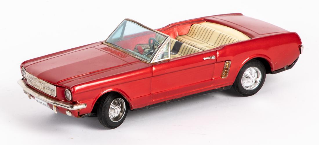 Bandai tin battery operated Mustang convertible: Bandai tin battery operated Mustang convertible, 11'' l. Provenance: Estate of Jonathan Barrow, Los Angeles, California.