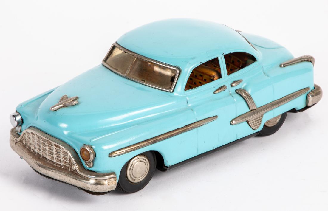 Japanese tin friction Pontiac sedan: Japanese tin friction Pontiac sedan, 10 1/2'' l. Provenance: Estate of Jonathan Barrow, Los Angeles, California.