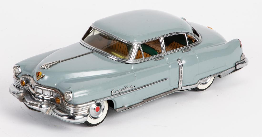 Japanese Marusan tin friction Cadillac: Japanese Marusan tin friction Cadillac, 12 1/2'' l. Provenance: Estate of Jonathan Barrow, Los Angeles, California.