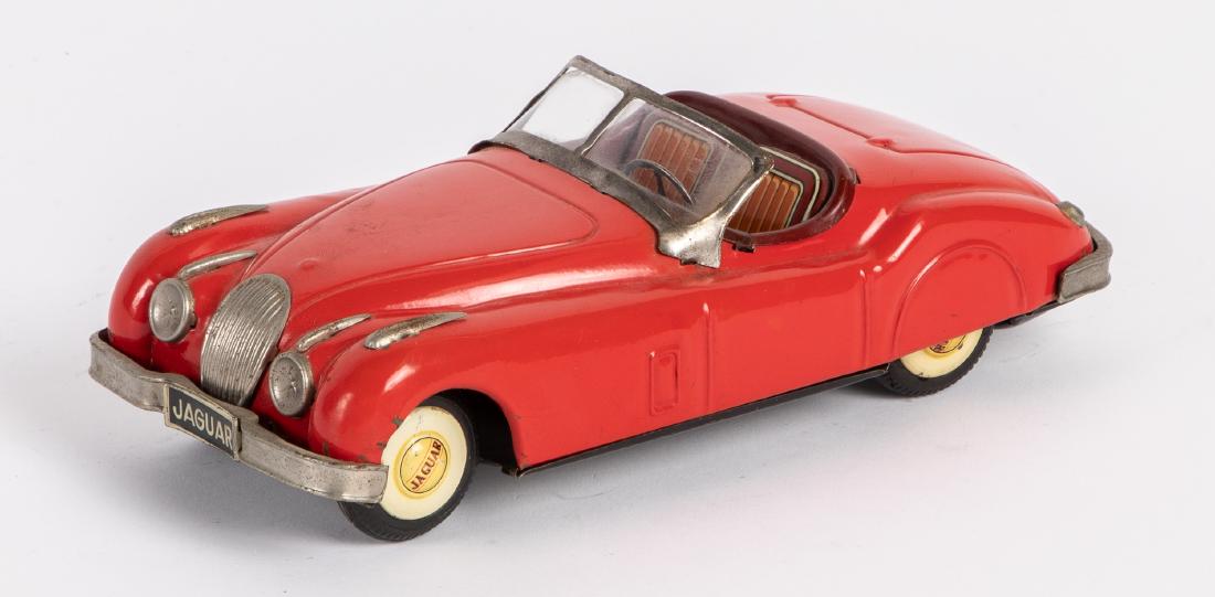 Japanese tin friction Jaguar convertible: Japanese tin friction Jaguar convertible, 9 1/2'' l. Provenance: Estate of Jonathan Barrow, Los Angeles, California.