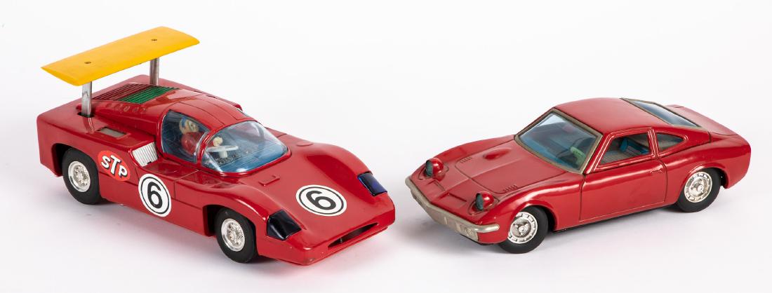 Japanese tin battery operated Opel, etc.: Japanese tin battery operated Opel, 9 3/4'' l., together with a Japanese Alps battery operated Chaparral, with driver, 10 3/4'' l. Provenance: Estate of Jonathan Barrow, Los Angeles, California.
