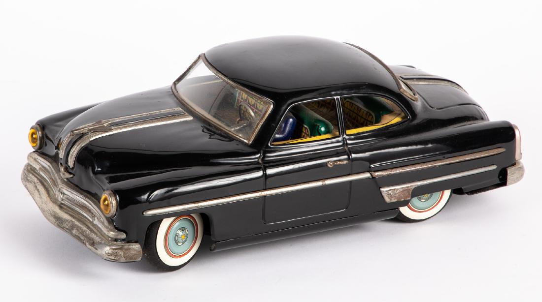 Japanese Ichiko tin friction 1953 Pontiac: Japanese Ichiko tin friction 1953 Pontiac Super Lincoln car, with driver, 14 3/4'' l. Provenance: Estate of Jonathan Barrow, Los Angeles, California.