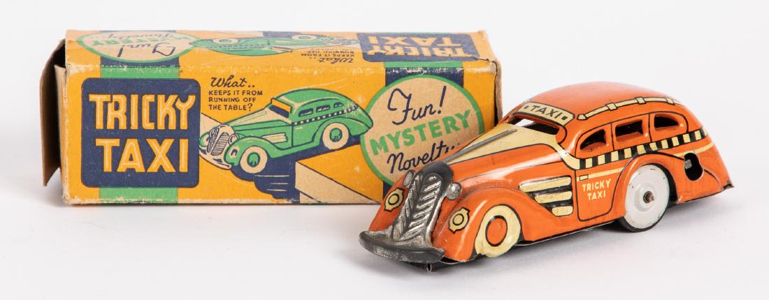 Marx tin lithograph wind-up Tricky Taxi: Marx tin lithograph wind-up Tricky Taxi, with original box and key, 4 1/2'' l. Provenance: Estate of Jonathan Barrow, Los Angeles, California.