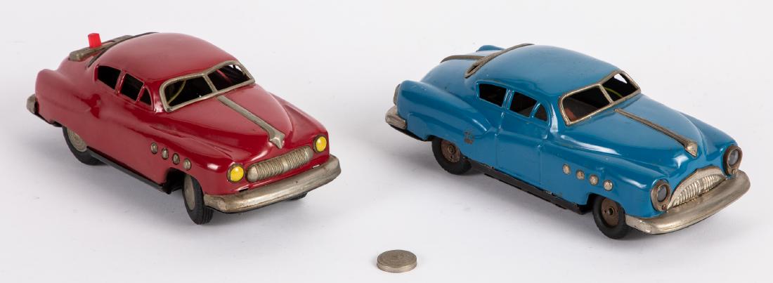 Two Japanese tin battery operated coupes: Two Japanese tin battery operated coupes, one marked LHC, 9'' and 8 3/4'' l. Provenance: Estate of Jonathan Barrow, Los Angeles, California.