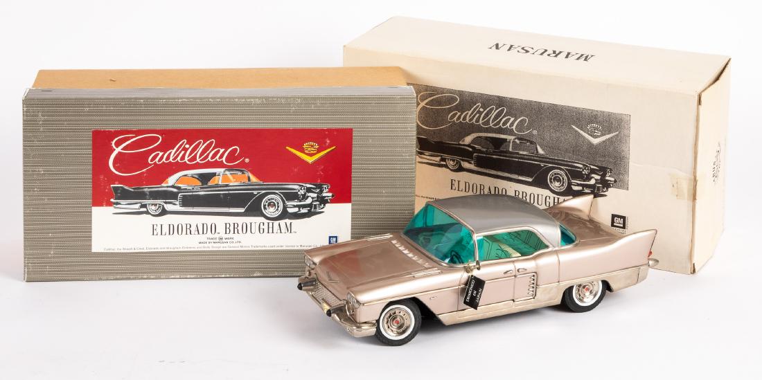 Contemporary Japanese Marusan friction Cadillac: Contemporary Japanese Marusan tin friction Cadillac Broughham in the original box and sleeve, 14 1/2'' l. Provenance: Estate of Jonathan Barrow, Los Angeles, California.