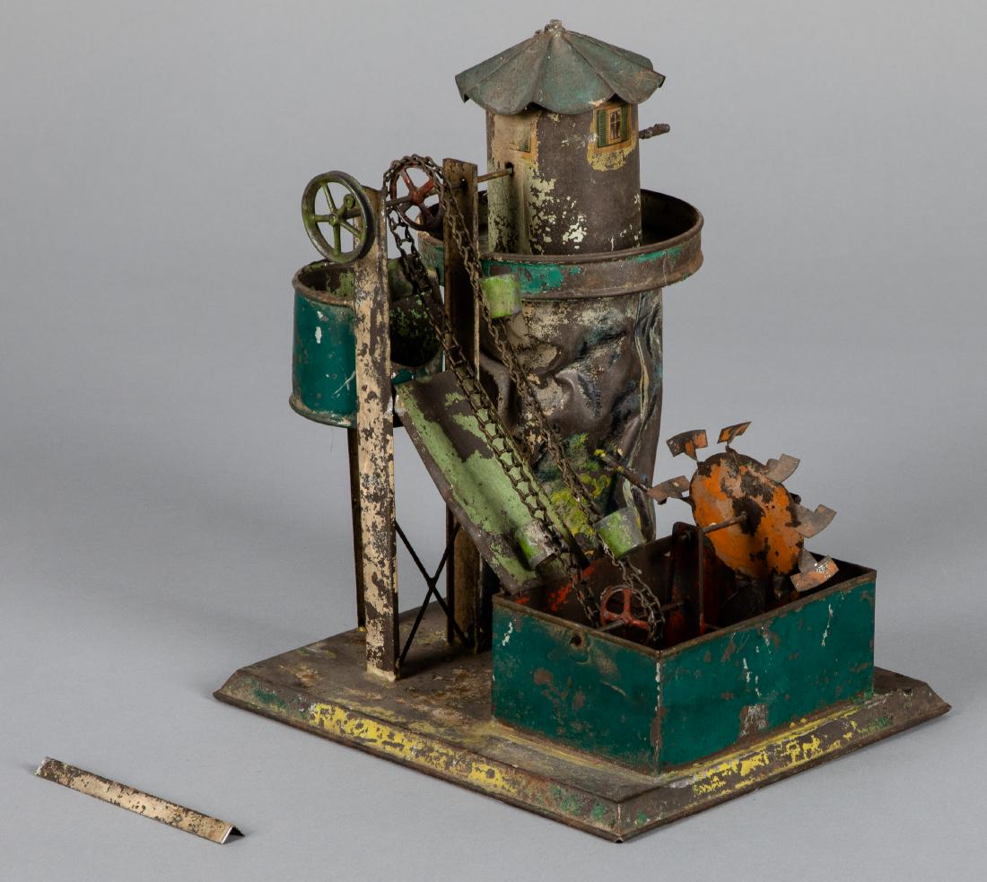 Carette painted tin windmill with dredge steam toy: Carette painted tin windmill with dredge steam toy accessory, 10'' h. Pictured in Morton A. Hirschberg Steam Toys - A Symphony in Motion, page 86. Provenance: Morton A. Hirschberg.