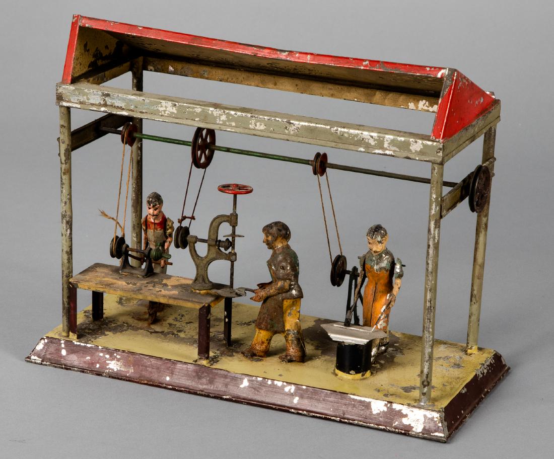 Arnold painted tin three man workshop steam toy: Arnold painted tin three man workshop steam toy accessory, 9 3/4'' h., 12 3/4'' w. Provenance Gottschalk collection. Pictured in Morton A. Hirschberg Steam Toys - A Symphony in Motion, page 20