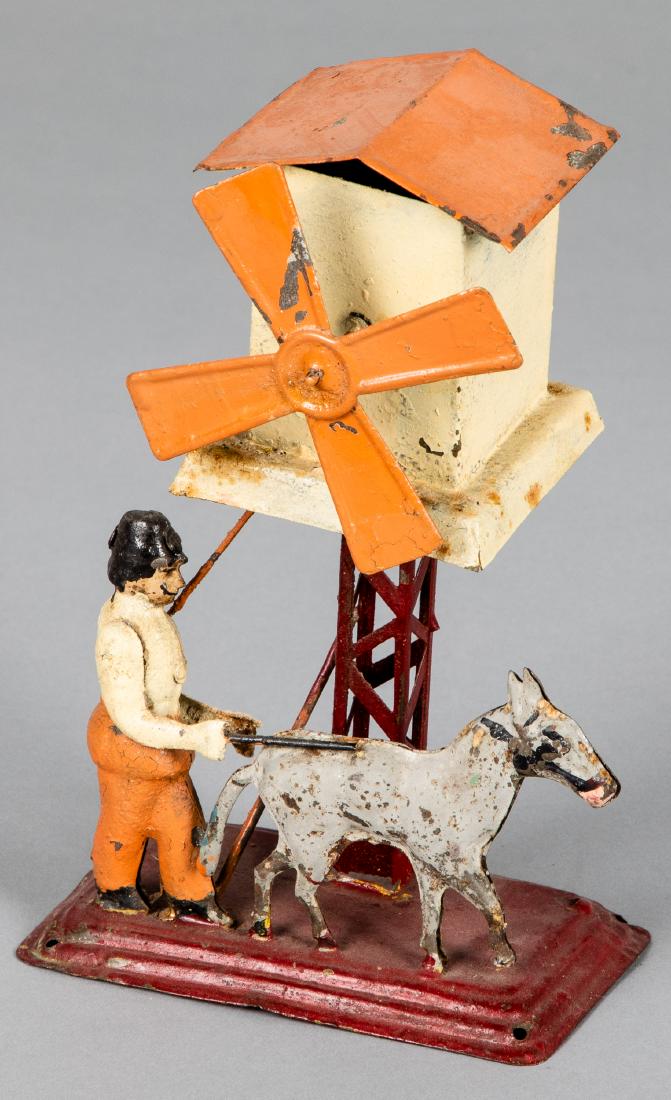 Painted tin windmill steam toy accessory: Painted tin windmill steam toy accessory, probably Bing, with a miller and mule, 8'' h. Pictured in Morton A. Hirschberg Steam Toys - A Symphony in Motion, page 70. Provenance: Morton A. Hirschberg.