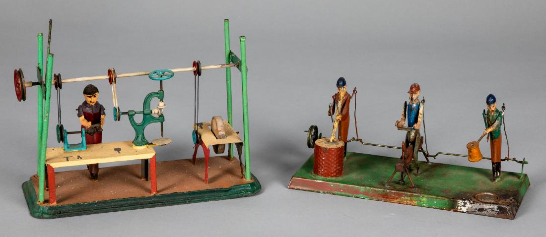 Two painted tin workshop steam toy accessories: Two painted tin workshop steam toy accessories, largest is Arnold, 6 1/2''. Pictured in Morton A. Hirschberg Steam Toys - A Symphony in Motion, page 19. Provenance: Morton A. Hirschberg.