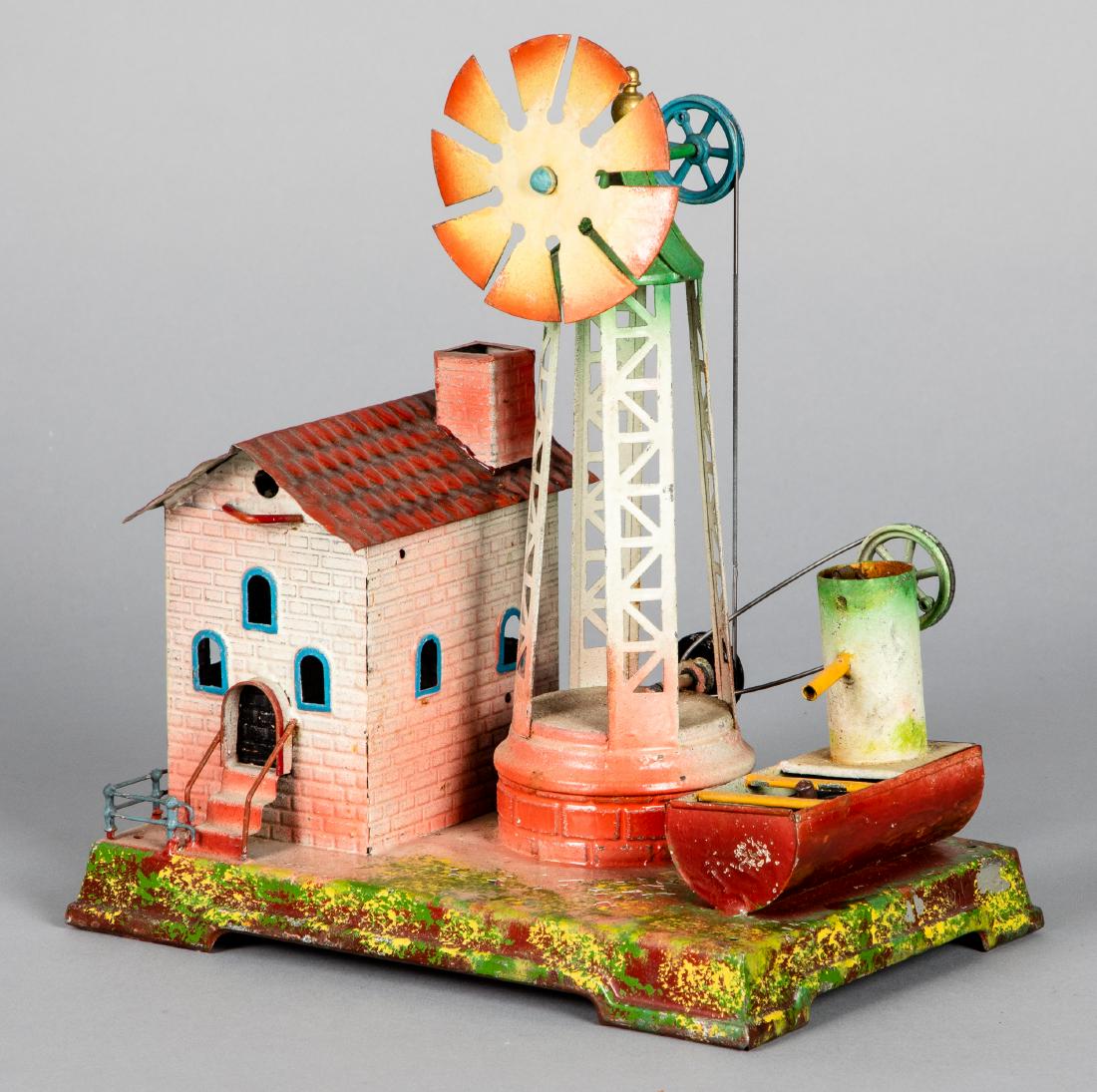 Falk painted tin windmill steam toy accessory: Falk painted tin windmill steam toy accessory, #260, with pump, 11'' h. Pictured in Morton A. Hirschberg Steam Toys - A Symphony in Motion, page 139. Provenance: Morton A. Hirschberg.