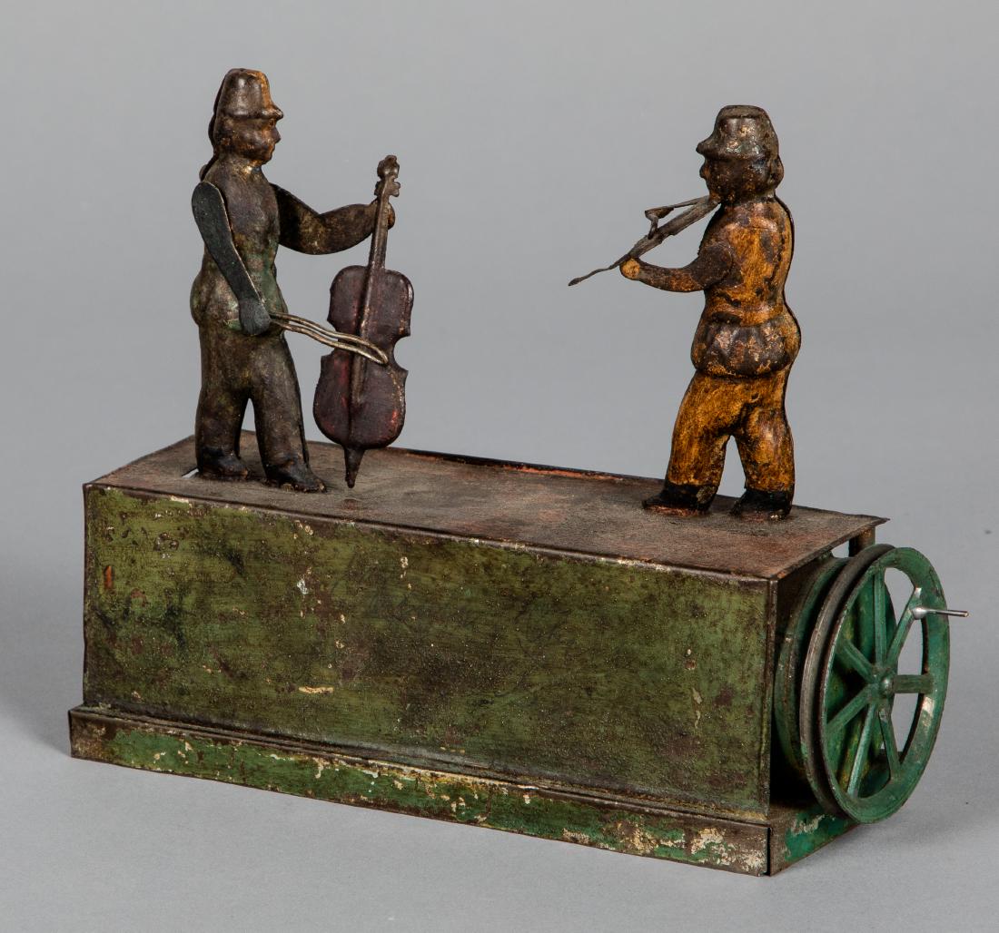 Painted tin musicians steam toy accessory: Painted tin musicians steam toy accessory, probably Bing, 6'' h., 7'' w. Pictured in Morton A. Hirschberg Steam Toys - A Symphony in Motion, page 72. Provenance: Morton A. Hirschberg.