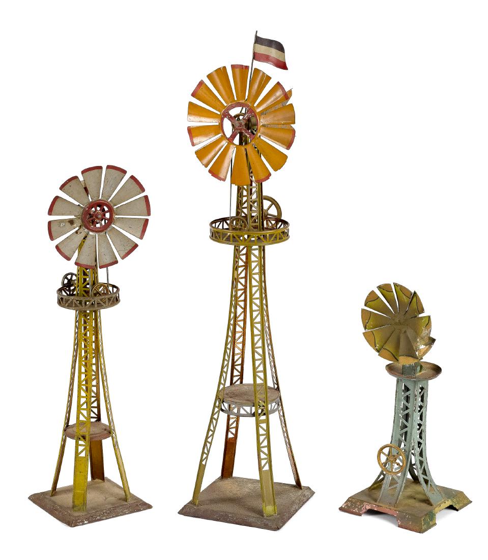 Three Carette painted tin windmill steam toys: Three Carette painted tin windmill steam toy accessories, smallest is #697/41, tallest - 24 1/4'' h. Pictured in Morton A. Hirschberg Steam Toys - A Symphony in Motion, Pictured in Morton A. Hirschber
