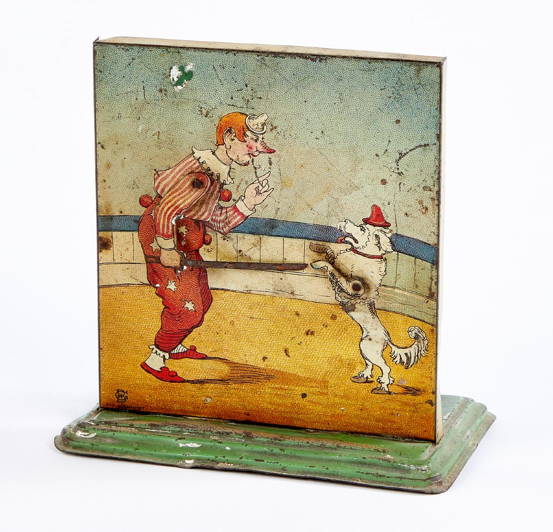 Bing tin lithograph clown with dog steam toy: Bing tin lithograph clown with dog steam toy accessory, number nine of a series of twelve, although unmarked, 4 1/2'' h., 4 1/2'' w., 2 3/4'' d. Provenance: Morton A. Hirschberg.