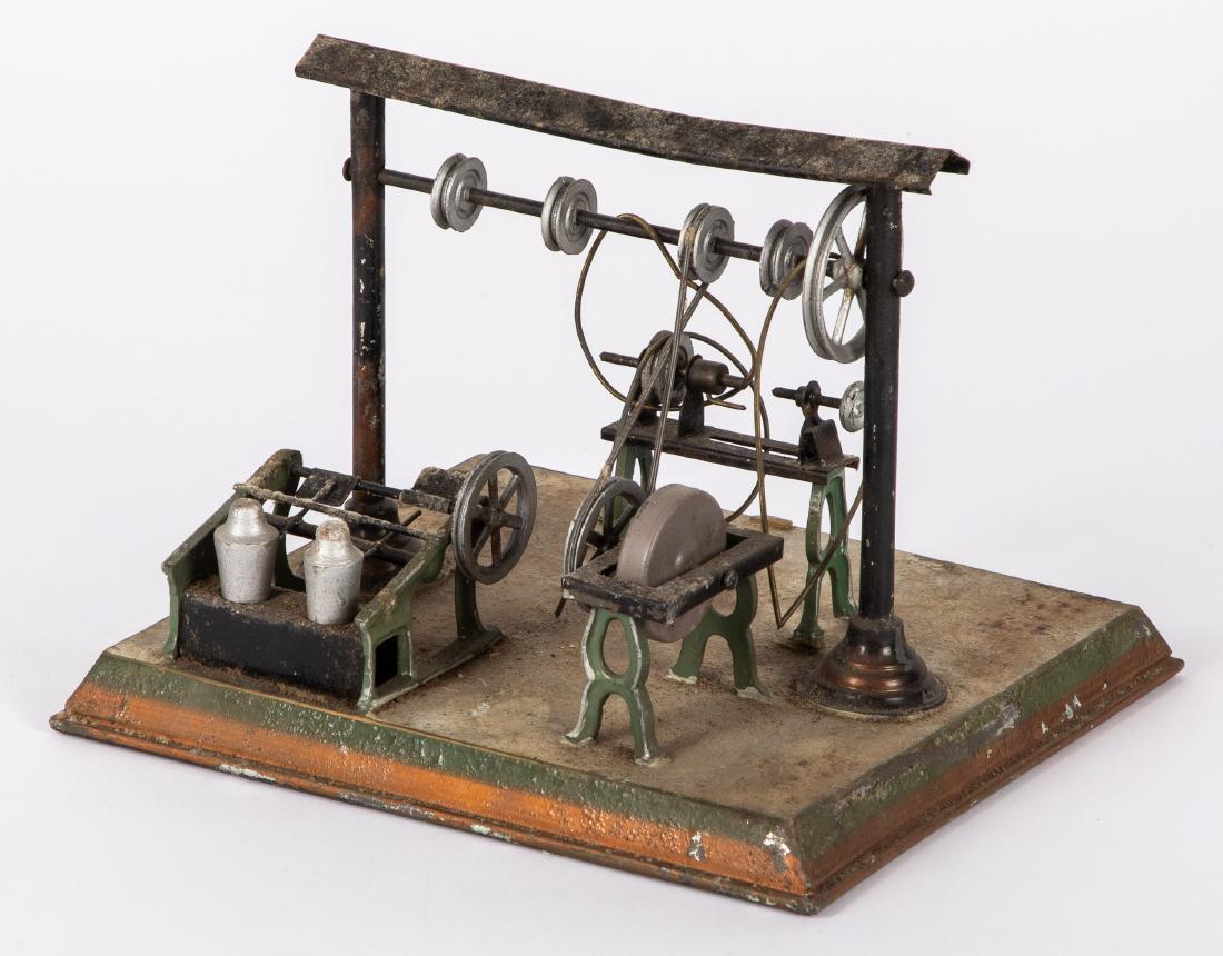 Painted tin workshop steam toy accessory: Painted tin workshop steam toy accessory, 7'' h., 9'' w. Provenance: Morton A. Hirschberg.
