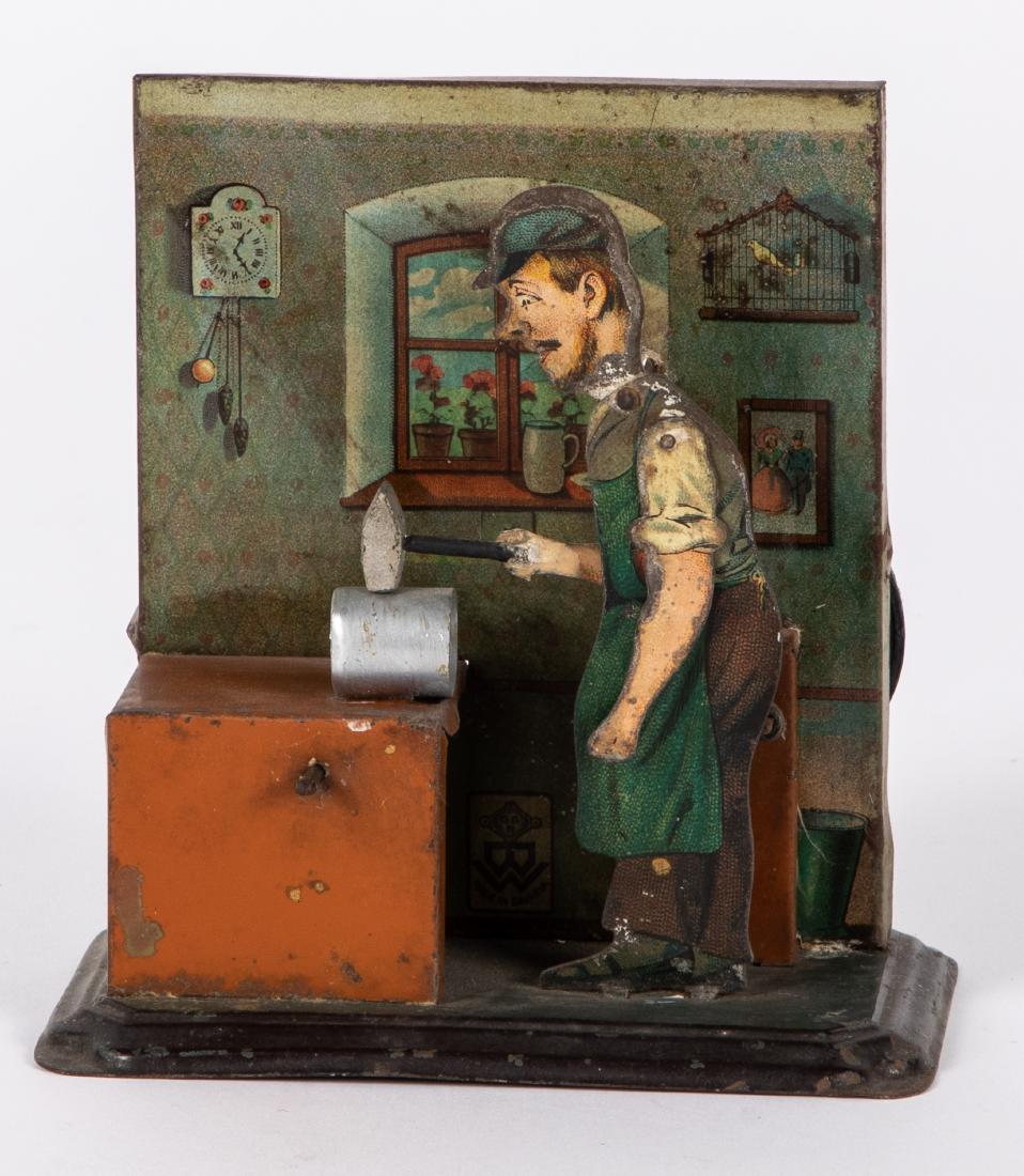 Bing tin lithograph tinsmith steam toy accessory: Bing tin lithograph tinsmith steam toy accessory, #9956/477, with background wall, 4 3/4'' h. Pictured in Morton A. Hirschberg Steam Toys - A Symphony in Motion, page 43. Provenance: Morton A. Hirschb