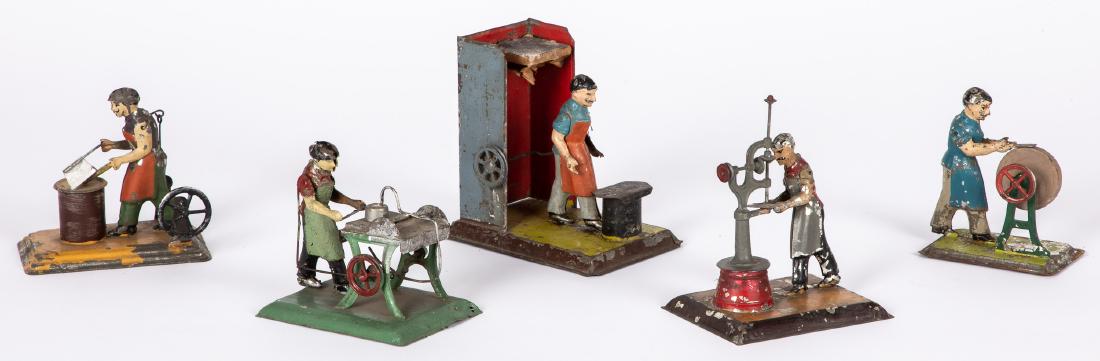 Five painted tin workmen steam toy accessories: Five painted tin workmen steam toy accessories, to include Bing , man at a drill press, a hat presser, a butcher with bone and cleaver, etc., tallest - 5 1/4''. Pictured in Morton A. Hirschberg Steam
