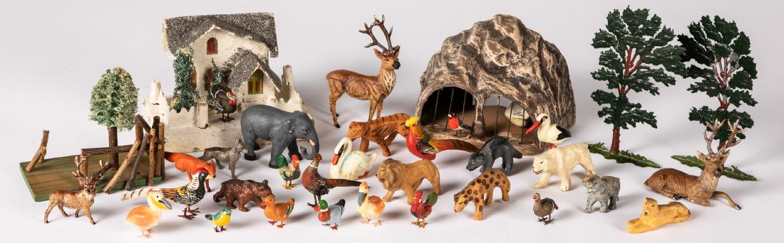 Group of composition, metal and wood putz animals: Group of composition, metal and wood putz animals, to include a German polar bear cage, cardboard house, etc.