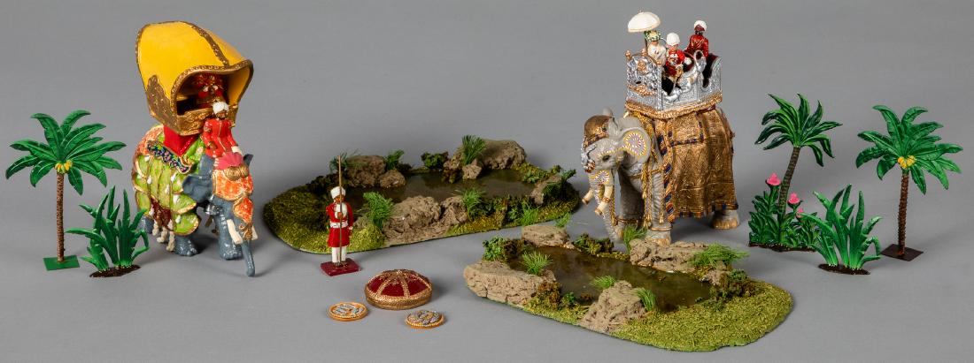 Two Marlborough Military Models painted elephants: Two Marlborough Military Models Durbar series painted lead elephants, and riders, tallest 6 1/4'' h., together with two ponds and trees.