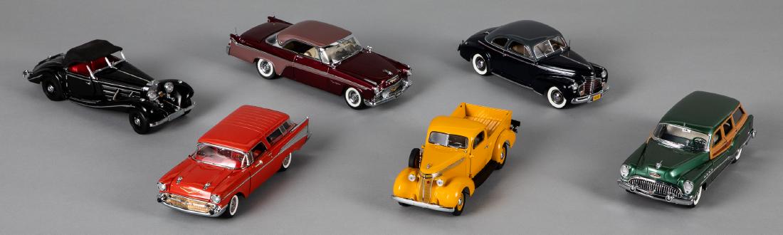 Six Franklin and Danbury Mint scale model cars: Six Franklin and Danbury Mint scale model cars, to include 1941 Chevrolet Deluxe Coupe, 1957 Chevrolet Bel Air, 1956 Desoto, 1937 Studebaker pick-up truck, and a 1953 Buick, together with another scal