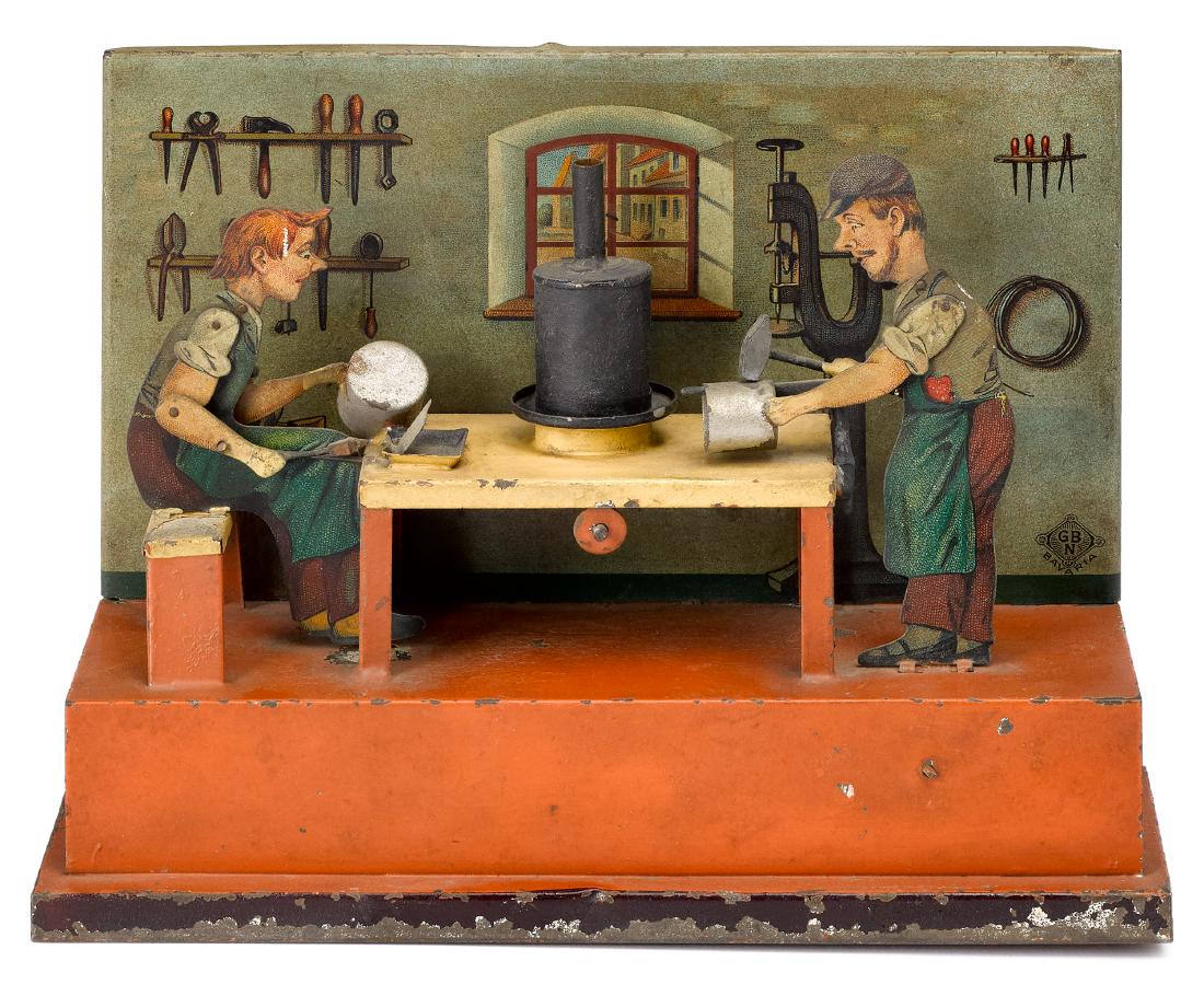 Bing tinsmith shop steam toy accessory: Bing painted and lithograph tin tinsmith shop steam toy accessory, #9956/380, with two workers flanking a smelting pot on the center table, 6 1/2'' h., 8 3/4'' w. Pictured in Morton A. Hirschberg Stea