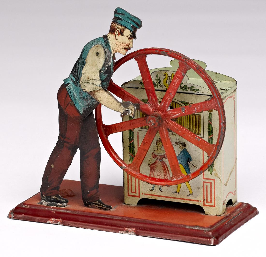 Bing organ grinder steam toy accessory: Bing tin lithograph musical organ grinder steam toy accessory, 4 1/4'' h., 5 1/4'' w. Pictured in Morton A. Hirschberg Steam Toys - A Symphony in Motion, page 39. Provenance: Morton A. Hirschberg Stea