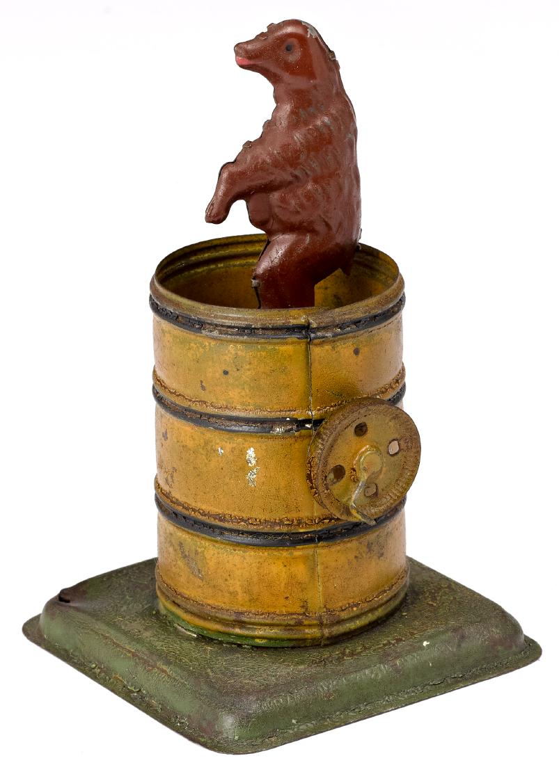 Dancing bear in a barrel steam toy accessory: Painted tin dancing bear in a barrel steam toy accessory, with hand crank, 5 1/4'' h. Provenance: Morton A. Hirschberg Steam Toy Collection.