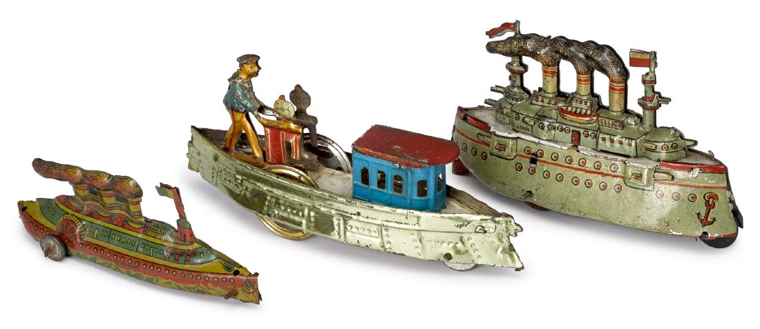 Three tin lithograph boat penny toys: Three tin lithograph boat penny toys, to include a Meier battleship, 3 3/4'' l., a side wheeler with smoke stacks, 3 1/2'' l., and a side wheeler, 4 1/2'' l.