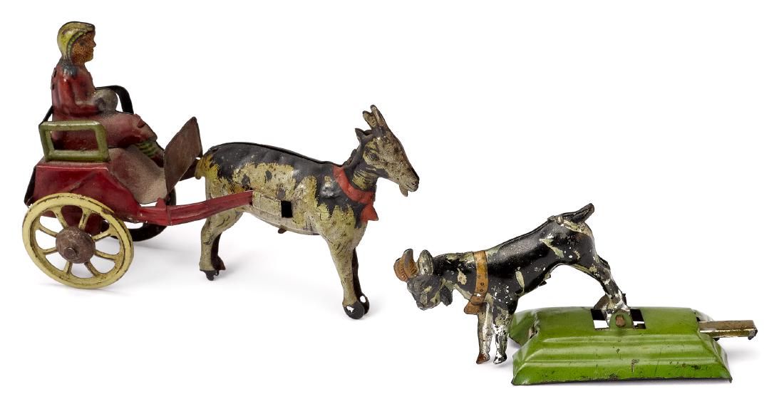 Two tin lithograph goat penny toys: Two tin lithograph goat penny toys, to include a girl in a goat cart, 3 1/2'' l. and an animated goat, 3'' l.