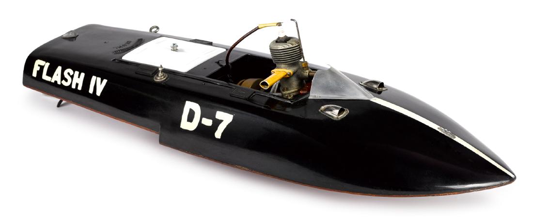 Gas powered tether hydroplane speedboat model: 1947 Reuhl gas powered tether hydroplane speedboat model, with Dennymite 60 engine, the hull made of Bakelite and mahogany, 26'' l.