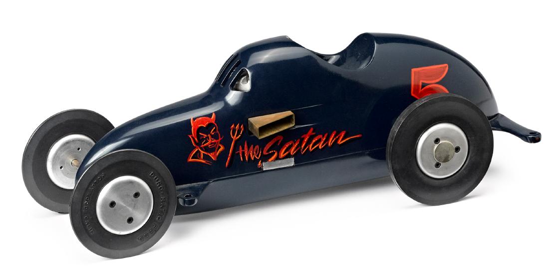 The Satan Hornet gas powered tether car: Contemporary aluminum the Satan Hornet gas powered tether car, with Super 60 gas engine, Duro-matic rubber tires, with custom dark blue paint with red devil image, 17 1/2'' l.