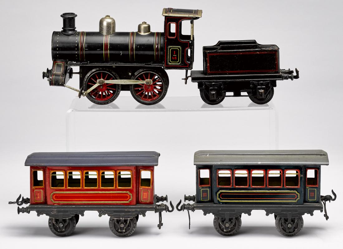 Bing painted tin clockwork four-piece train set: Bing painted tin clockwork four-piece train set, 1 gauge, to include a #48 locomotive with tender and two passenger cars, engine - 8 1/2'' l.