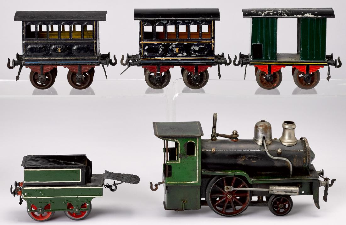 Schoenner painted tin live steam train: Schoenner painted tin live steam train, to include 0-4-0 English profile locomotive and tender, together with two Bing passenger cars and a Bing box car, engine - 9'' l.