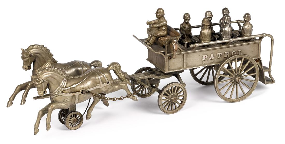 Nickel plated horse drawn police patrol wagon: Scarce Shimer nickel plated horse drawn police patrol wagon, with original driver and six seated policeman, 20 1/2'' l. Provenance: Collection of Bill and Stevie Weart.