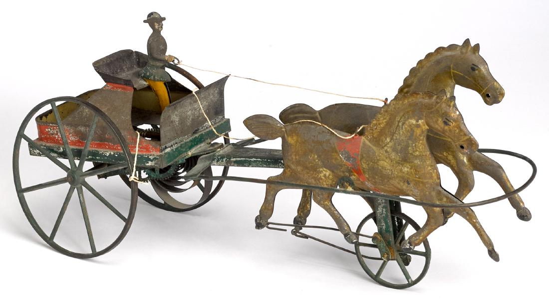 American tin clockwork horse with gig pull toy: Hull & Stafford painted American tin clockwork horse with gig pull toy, with painted tin driver, 16'' l.