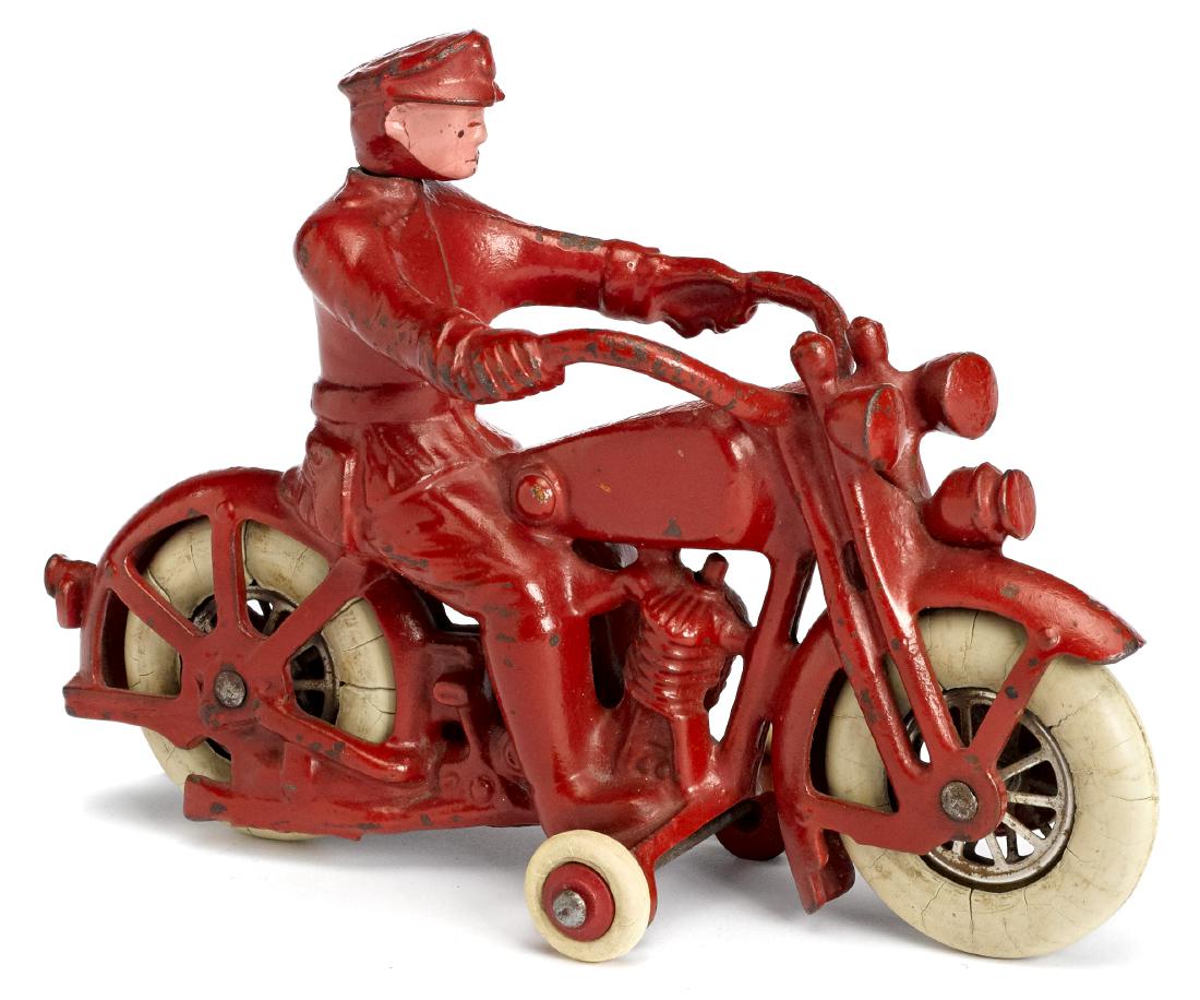 Harley Davidson police patrol motorcyle: Hubley cast iron Harley Davidson police patrol motorcycle, the driver with a swivel head, 7'' l. Provenance: Collection of Bill and Stevie Weart.