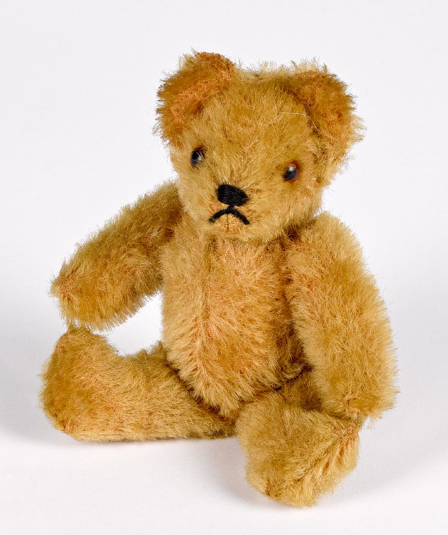 Small Steiff mohair teddy bear: Small Steiff mohair teddy bear, ca. 1940's-1950's, with glass eyes, 5 1/2'' h. Provenance: The Estate of Raymond and Nadine Gravatt, Ravenwood Farm, Cream Ridge, New Jersey.