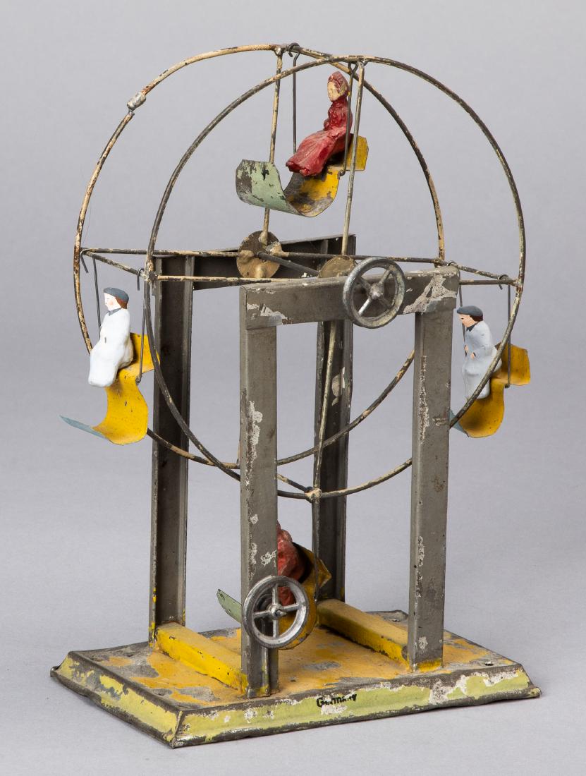 Krauss, Mohr & Co. Ferris wheel steam toy accessory: Krauss, Mohr & Co. painted tin Ferris wheel steam toy accessory, with four seats, each with a painted composition rider, 9 1/2'' h.