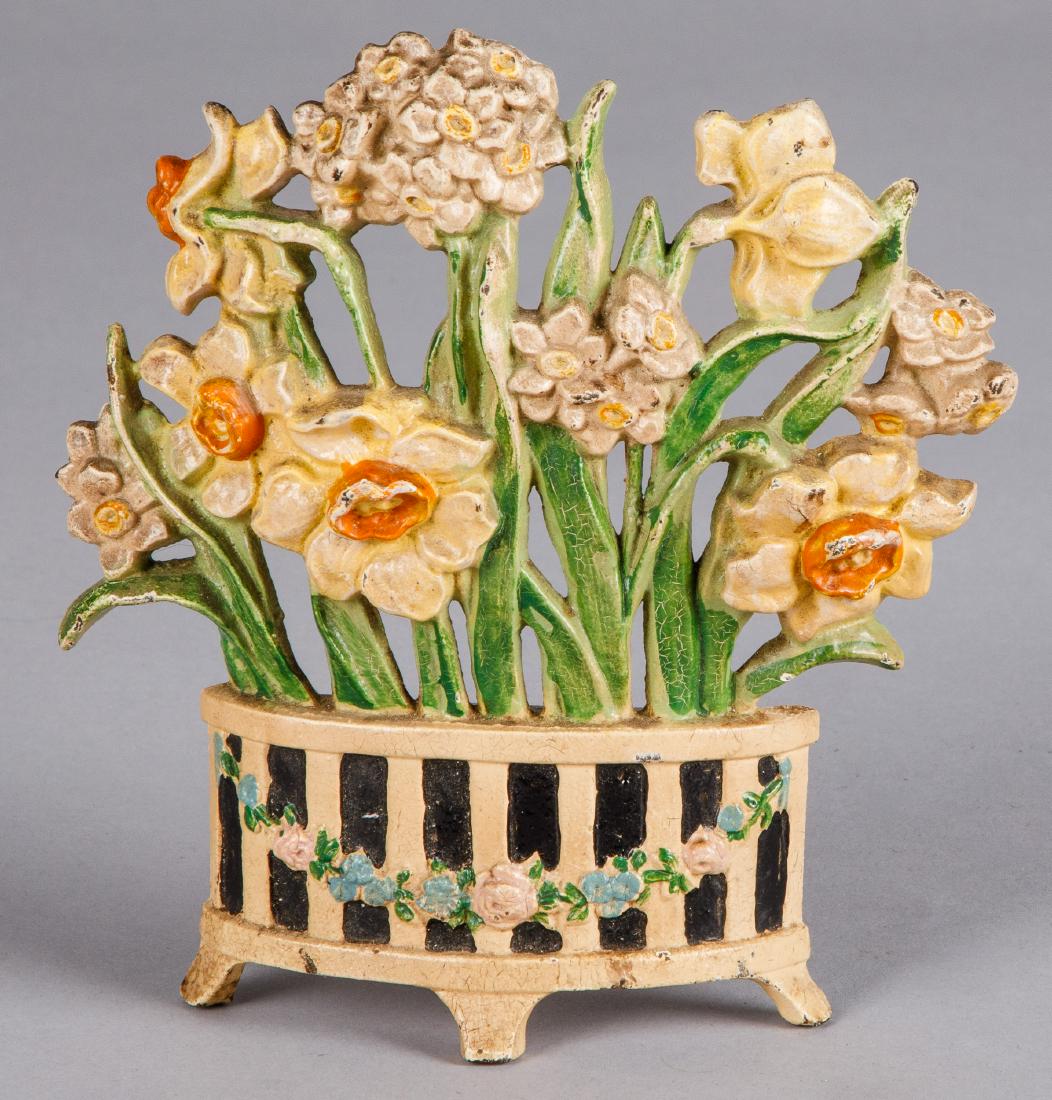 Hubley cast iron Narcissus flower pot doorstop: Hubley cast iron Narcissus flower pot doorstop, 7 1/2'' h.