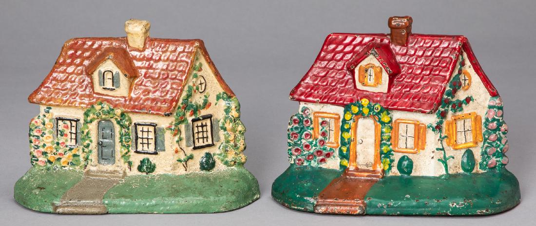 Two Hubley cast iron cottage doorstops: Two Hubley cast iron cottage doorstops, 5 1/2'' h.