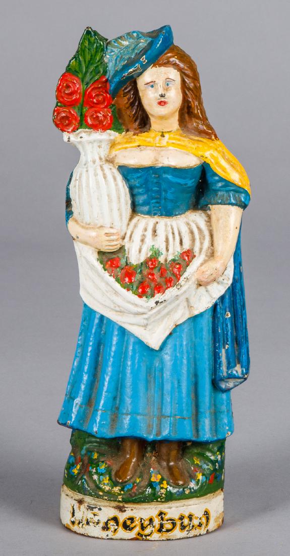 Three dimensional woman with roses doorstops: Cast iron three dimensional woman with roses doorstop, 12 1/4'' h.